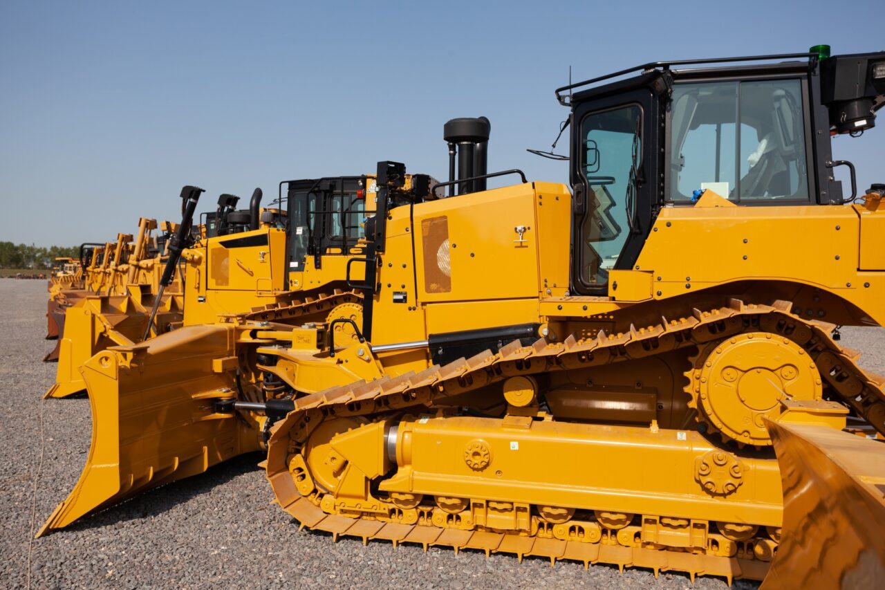 Row of bulldozers in a construction site